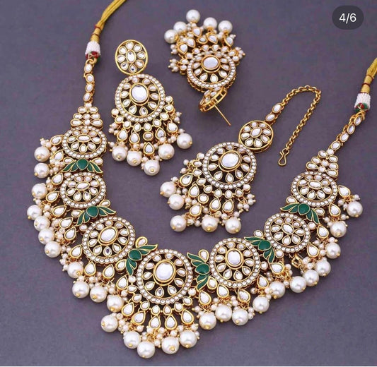 Premium quality kundan set with earrings and tikka