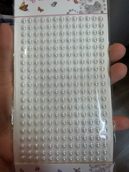 Sticky white pearls for hair